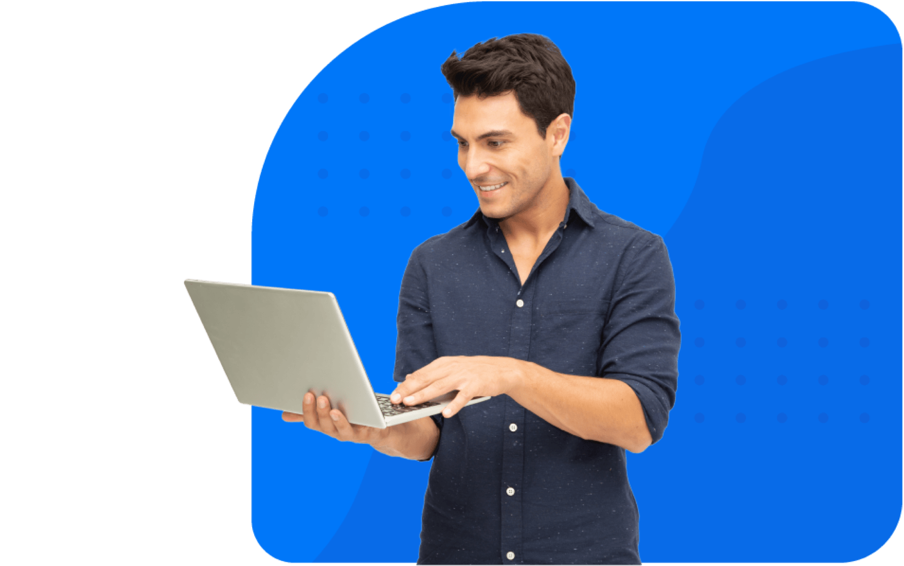 Smiling man standing with laptop in hands